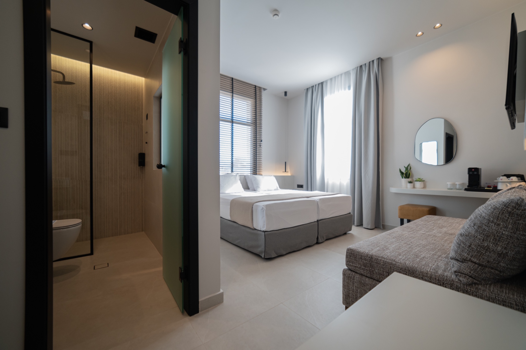 Deluxe Room with Extra Bed — view from the entrance towards the bed