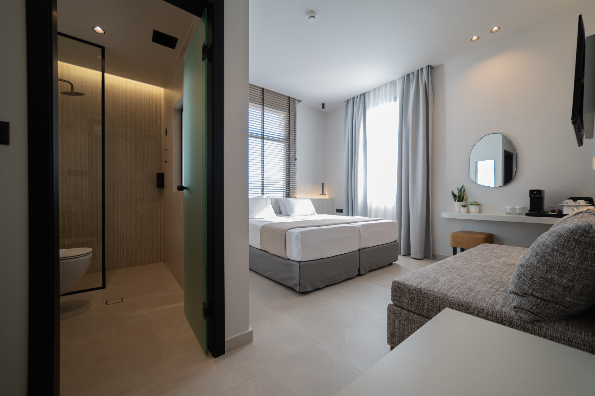 Deluxe Room with Extra Bed — full layout with en-suite bathroom, bed and lounge
