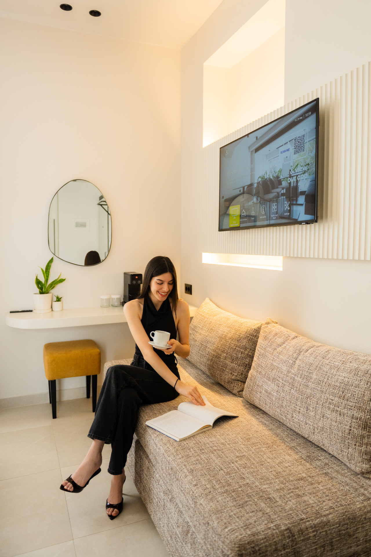 Deluxe Room with Extra Bed — morning coffee moment on the sofa bed