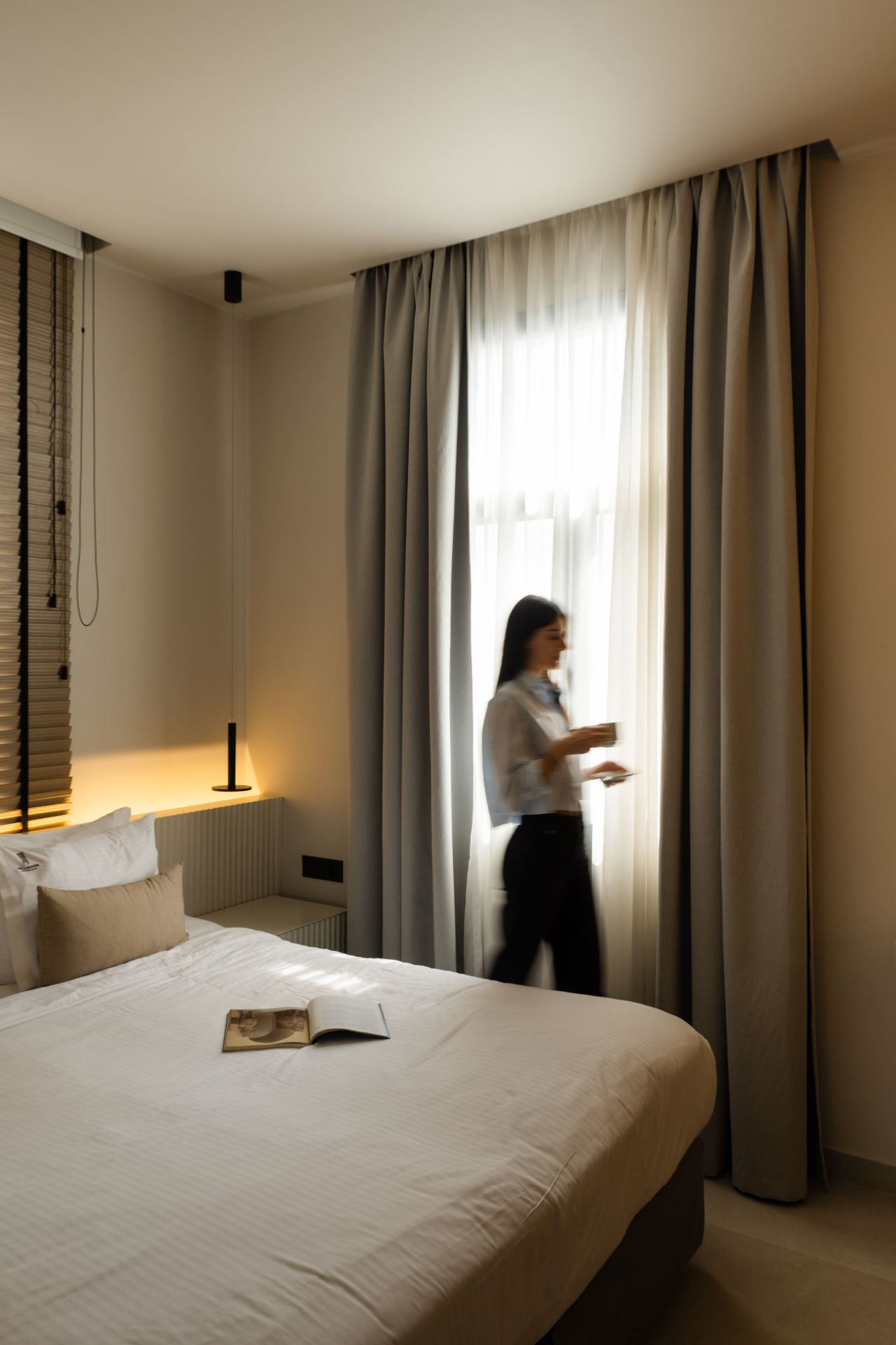 Deluxe Room with Extra Bed — soft daylight through sheer curtains